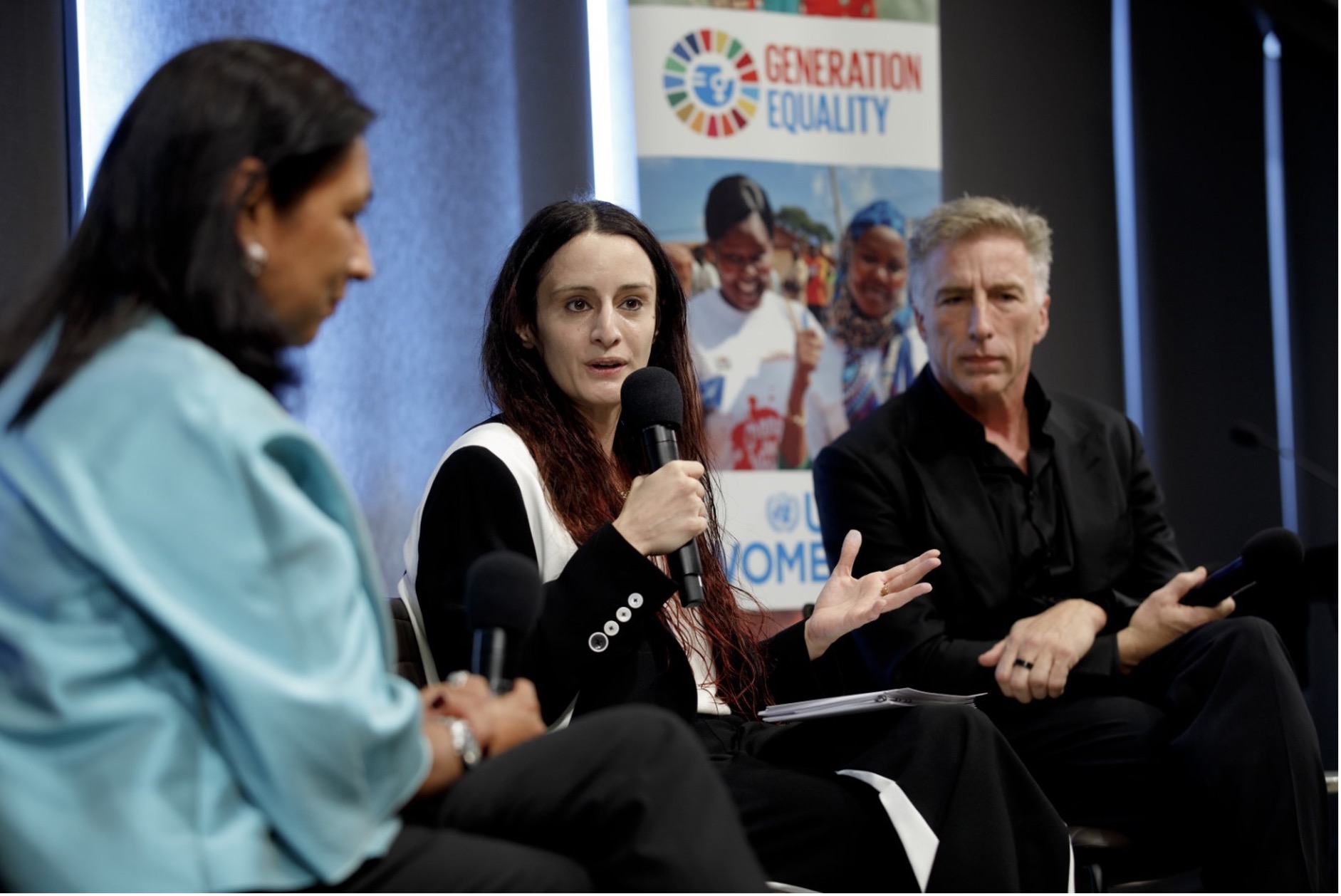 UN Women Deputy Executive Director Ms. Anita Bhatia, Koç Holding Board Member Ms. İpek Kiraç, and Logitech CEO Mr. Bracken Darrell in conversation with one another. There is a Generation Equality banner in the background.